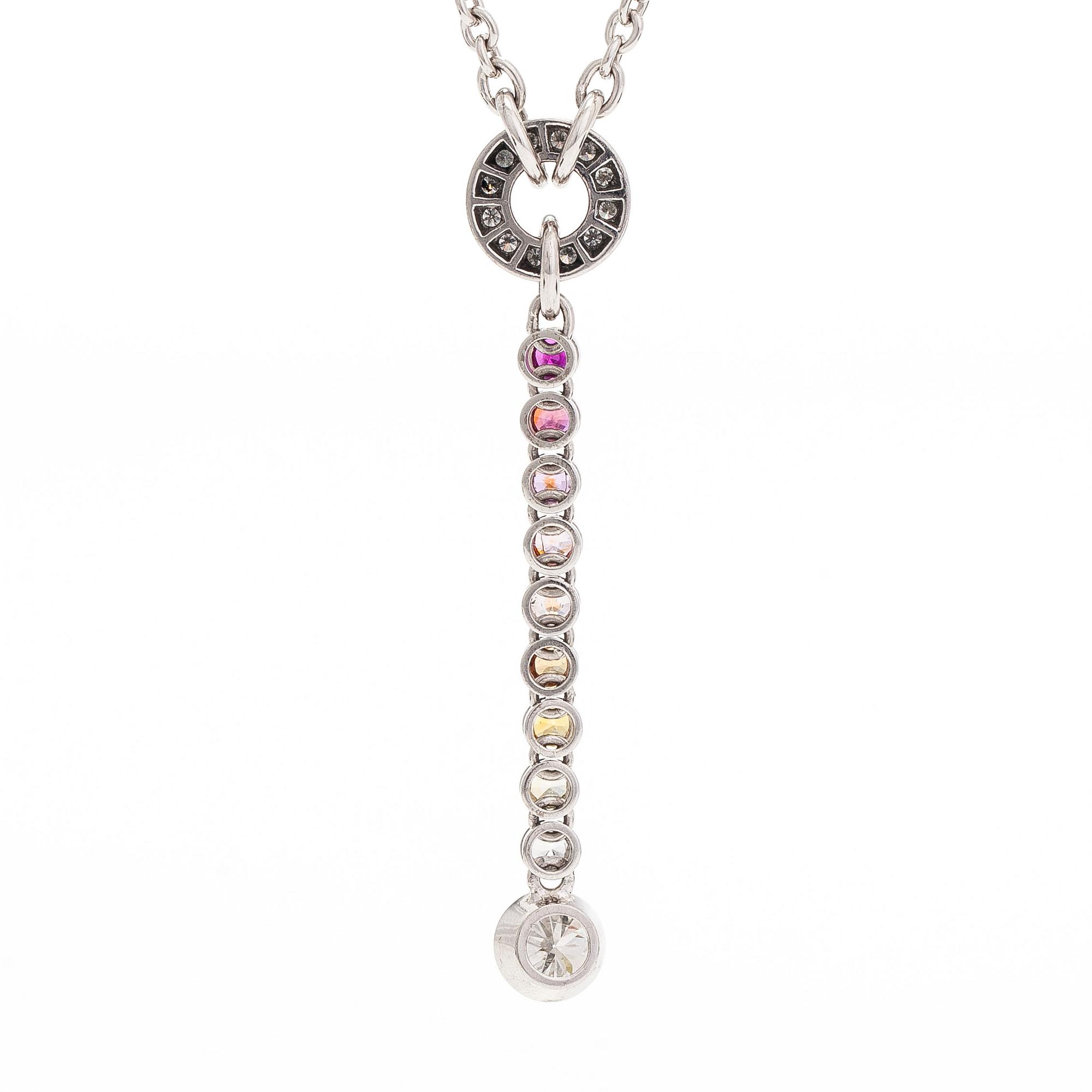 An 18K white gold necklace, set with brilliant-cut diamonds, a ruby, and sapphires. Kultaseppä Kulmala, Helsinki.