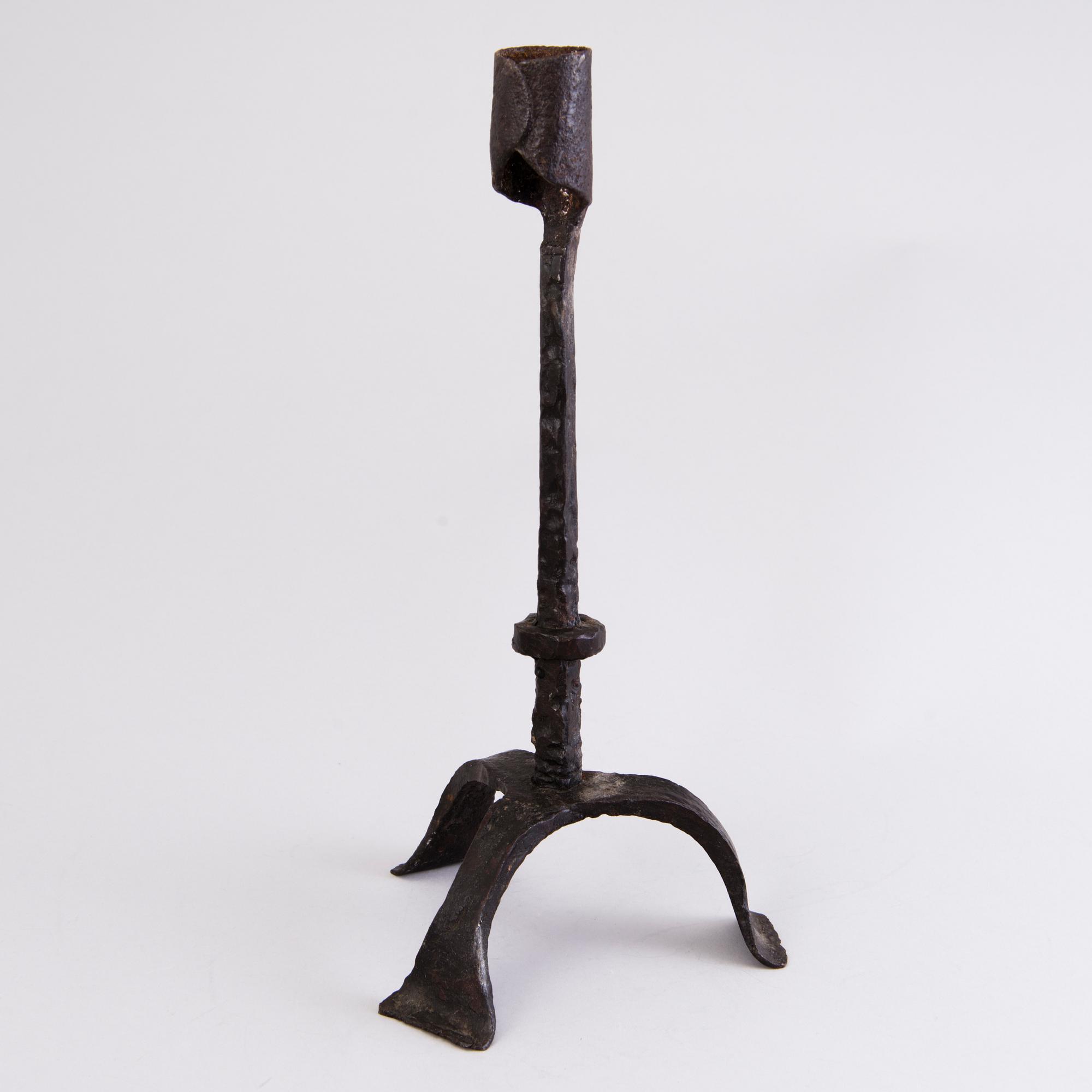 A CANDLESTICK, iron, 18th century or older.