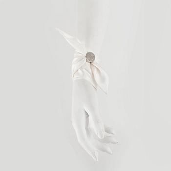 HERMÈS, three silk braclets with palladiumcovered locks.