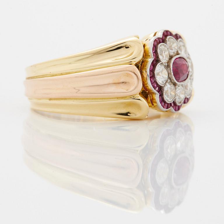 A WA Bolin ring in 18K gold set with rubies and round brilliant-cut diamonds.