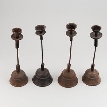 A group of four temple candle sticks, China, 20th Century.