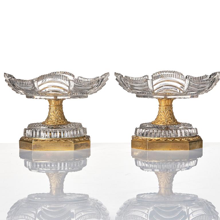 A pair of French Empire early 19th century gilt bronze and glass centre pieces.