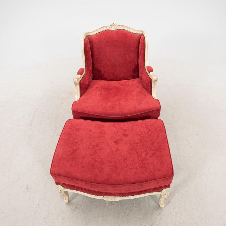 A Louis XV style armchair with stool second part of the 20th century.