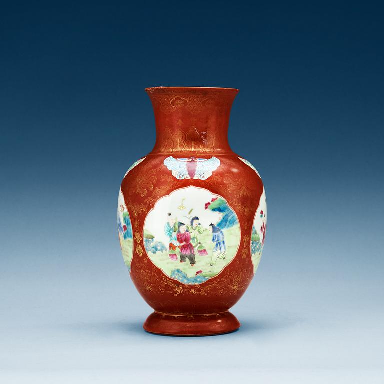 A coral ground famille rose vase, Qing dynasty.