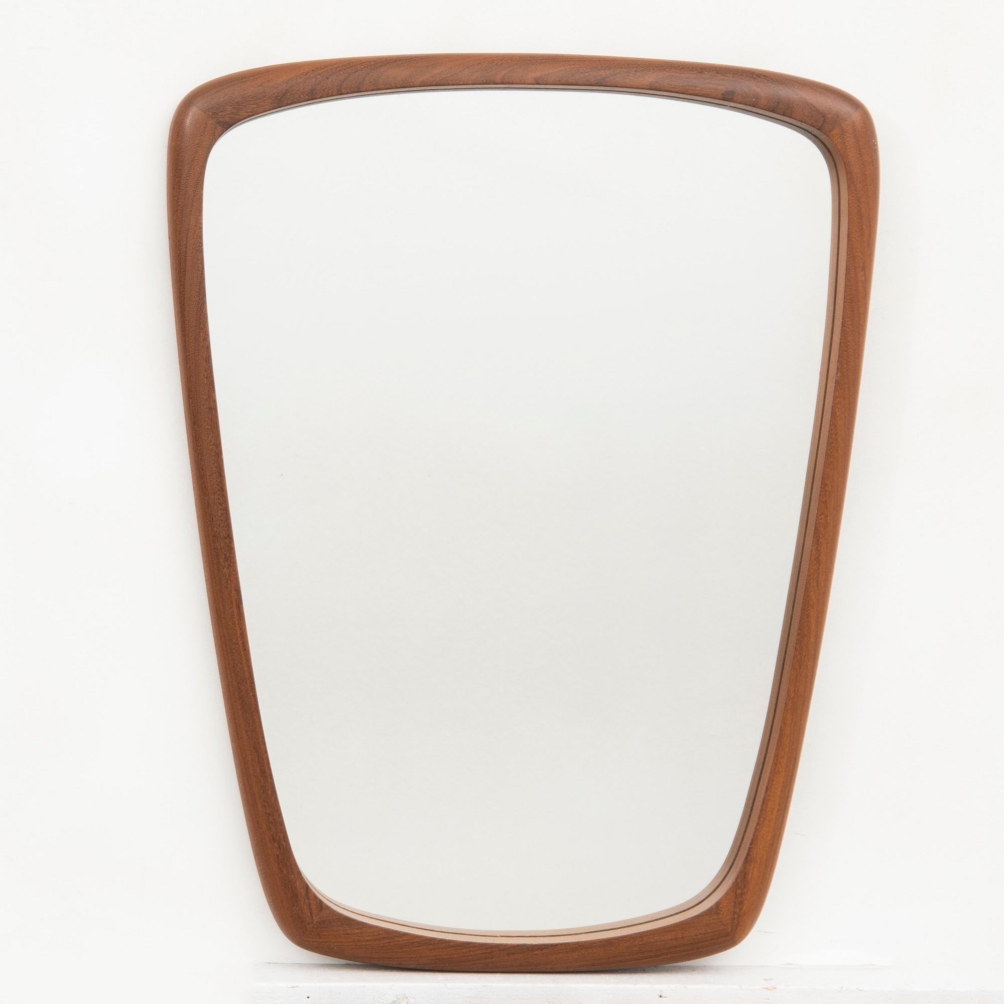 A 1940/50s walnut mirror.