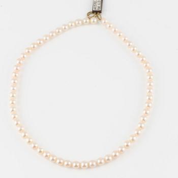 Three strands of cultured pearls, without clasps.