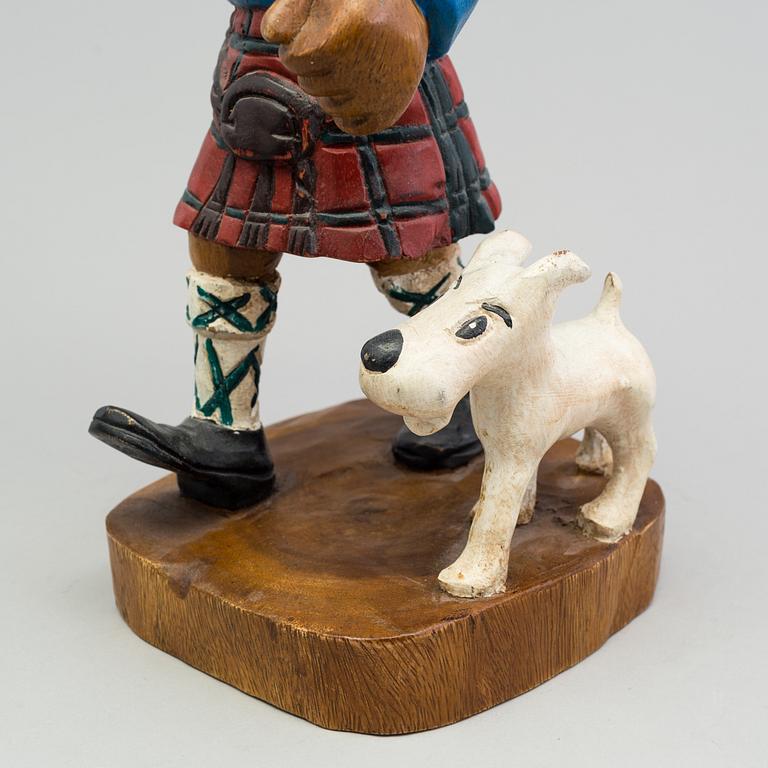 a Tintin and snowy wood scuplture from the second half of the 20th century.