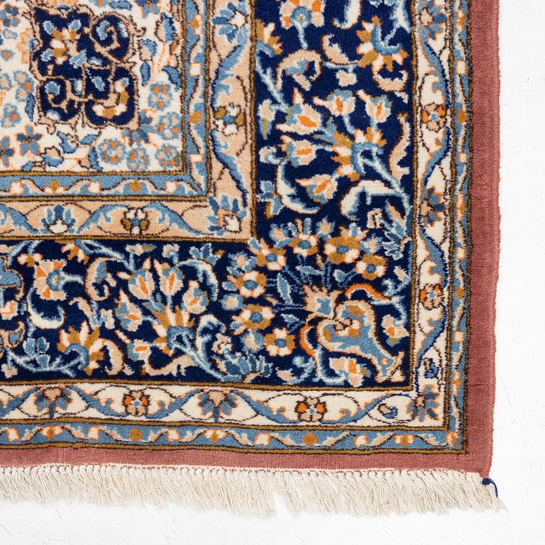 An carpet, possibly a Kerman, c. 310 x 230 cm.