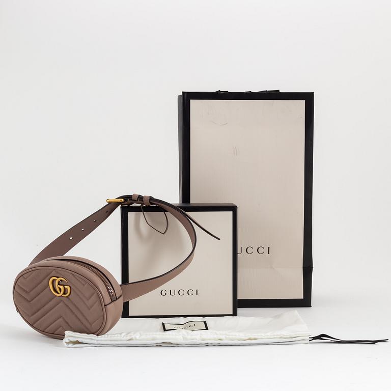 Gucci, a leather belt bag.