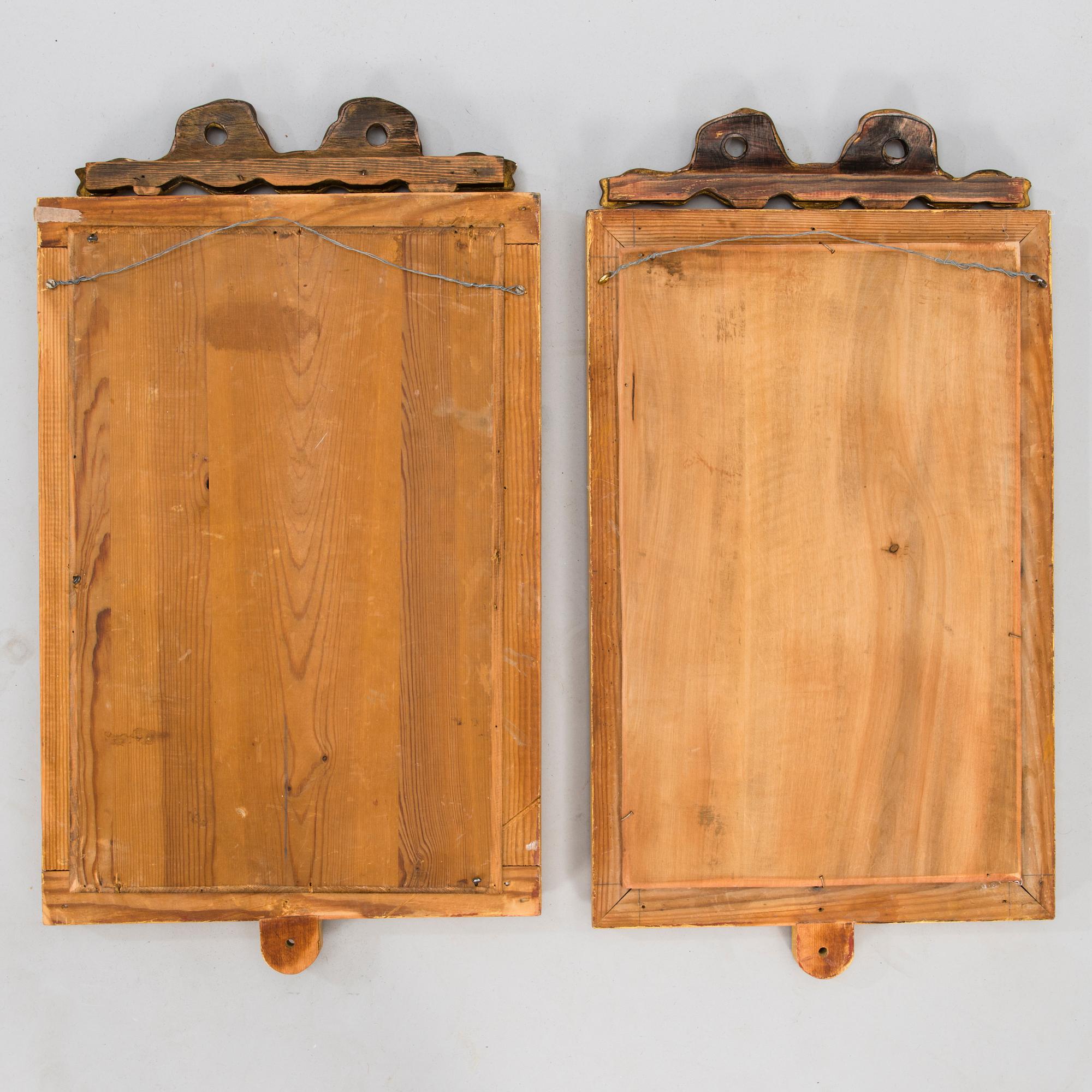 A pair of mirrored wall sconces from the latter half of the 20th century.