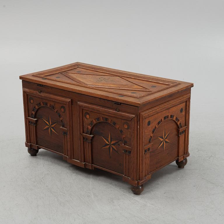 A Baroque style oak chest, end of the 19th Century with older parts.