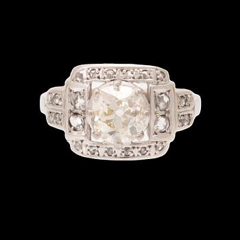 An 18K white gold ring set with an old cut diamond and rose cut diamonds.