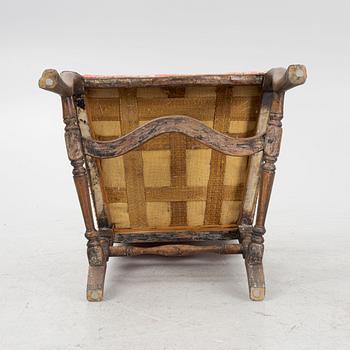 An oak baroque armchair from around the year 1700.