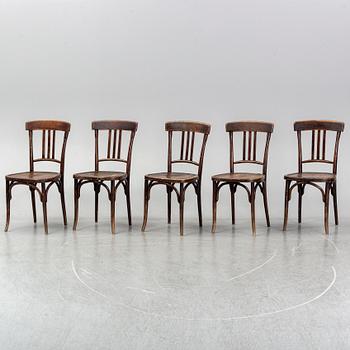 A matched set of four wooden chairs, first half of 20th Century.