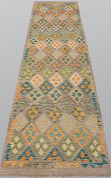 A Kilim runner, approx. 291 x 89 cm.