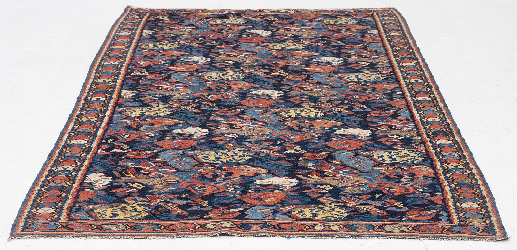A Kilim rug, Senneh, approx. 199 x 132 cm.