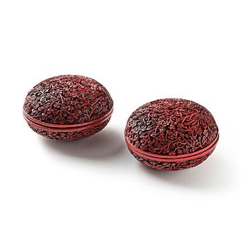 1016. A pair of red lacquer boxes, Qing dynasty, 18th century.