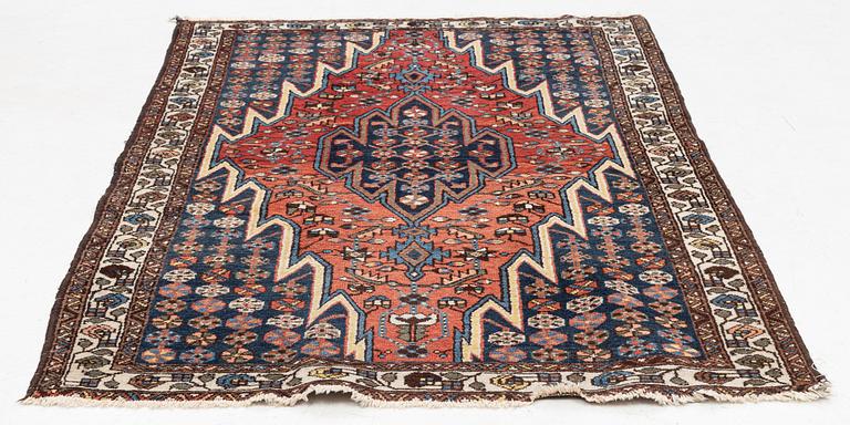 An oriental rug, circa 195 x 140 cm.