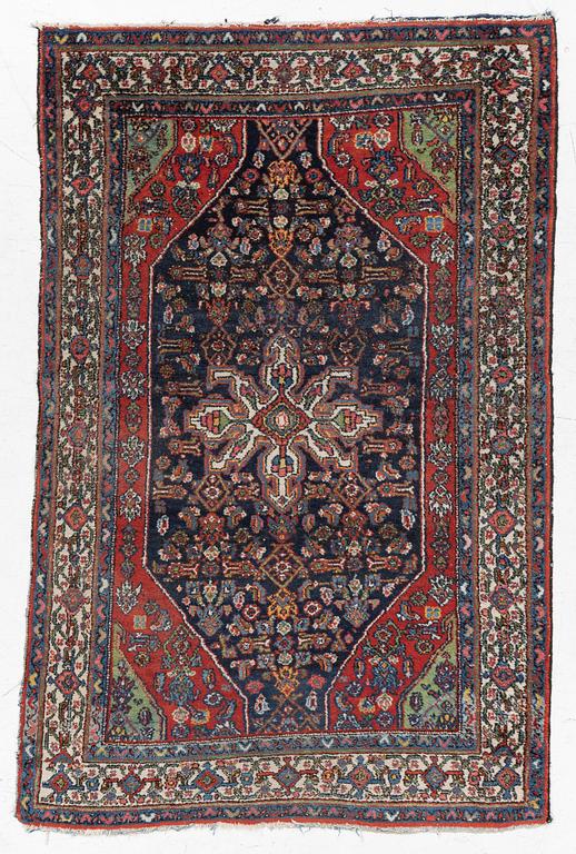 An oriental, semi-antique rug, c. 195 x 130 cm.