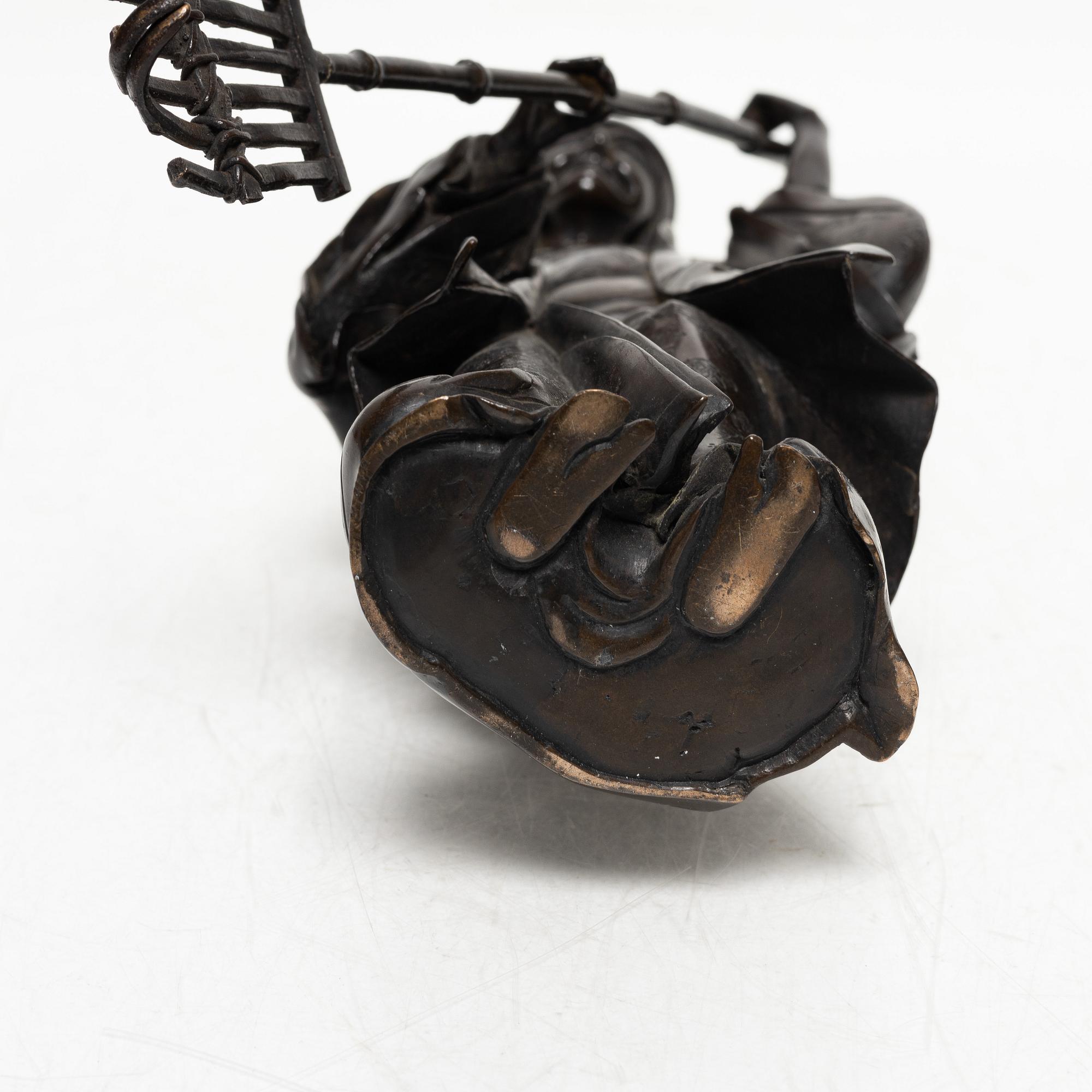 A Japanese bronze sculpture, of a gardener, Meiji period (1868-1912).