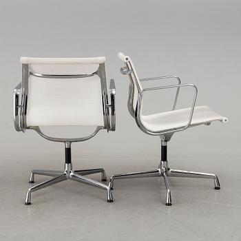 A pair of 'EA 108' desk chairs by Charles & Ray Eames for Vitra.