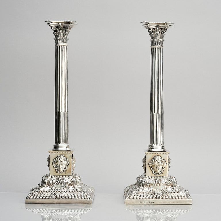 A pair of 18th century silver candlesticks, marks of Ebenezer Coker, London , possibly 1765.