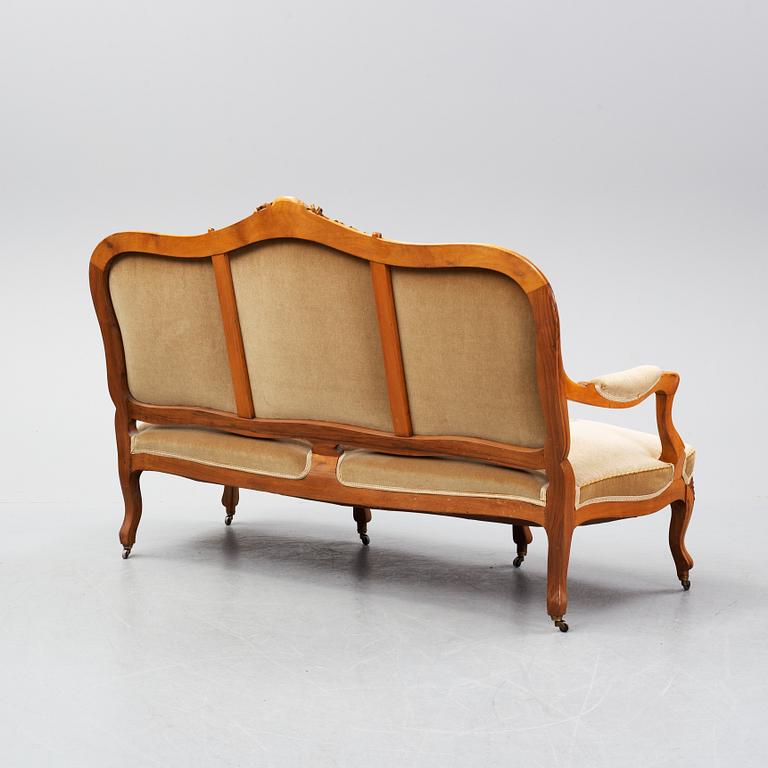 A set of sofa, two armchairs and six chairs, Louis XV-style, ca 1900.