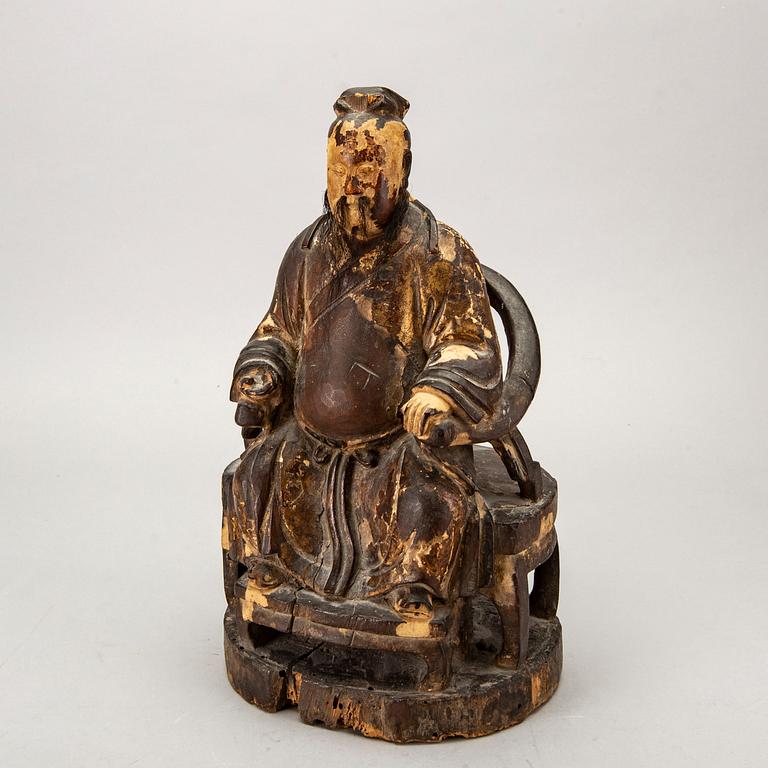A Chinese late Qing painted wooden sculpture.