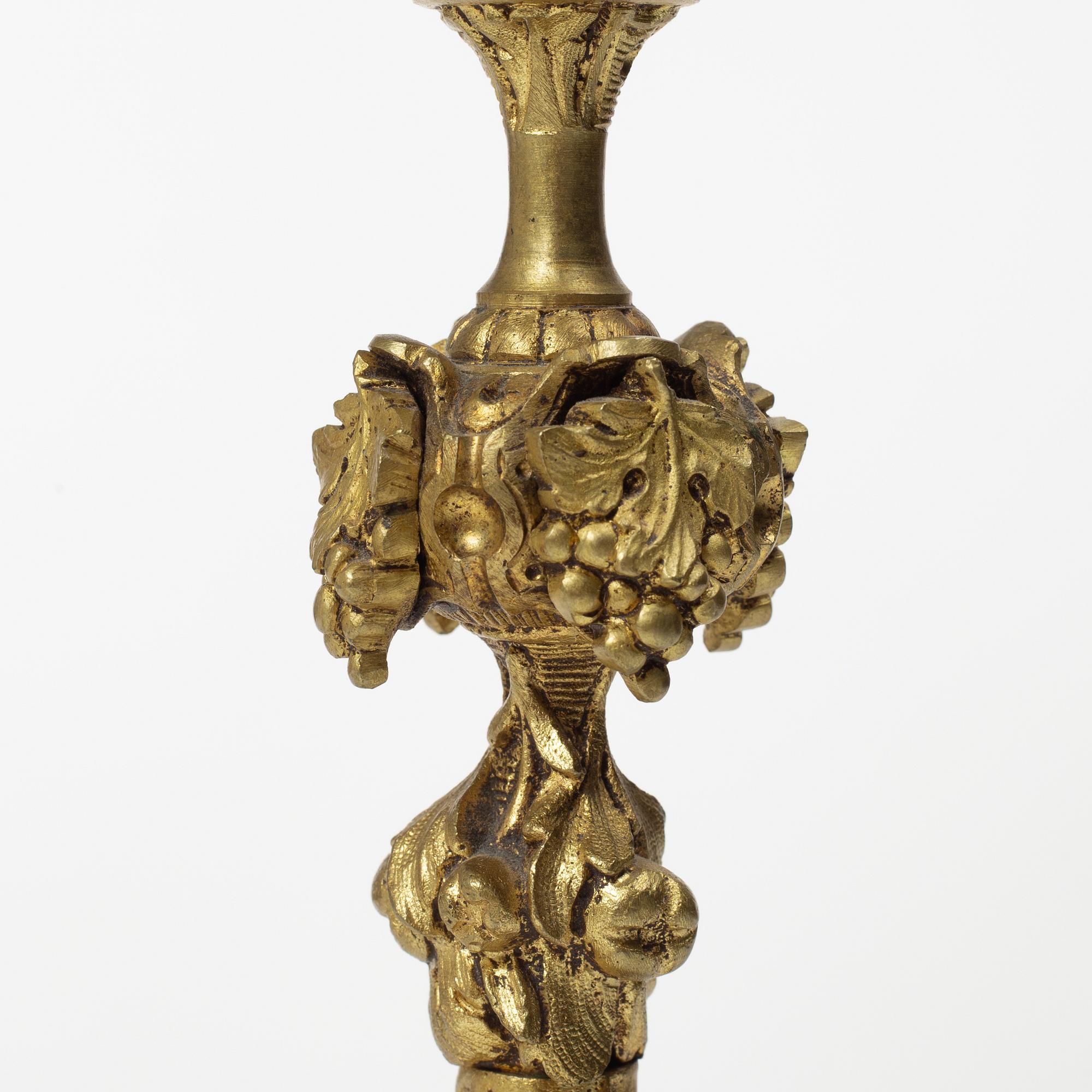 A pair of Oscarian brass candle sticks, Sweden, late 19th century.