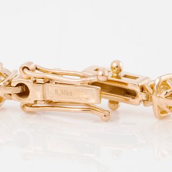 Tennis bracelet in 18K gold with brilliant-cut diamonds.