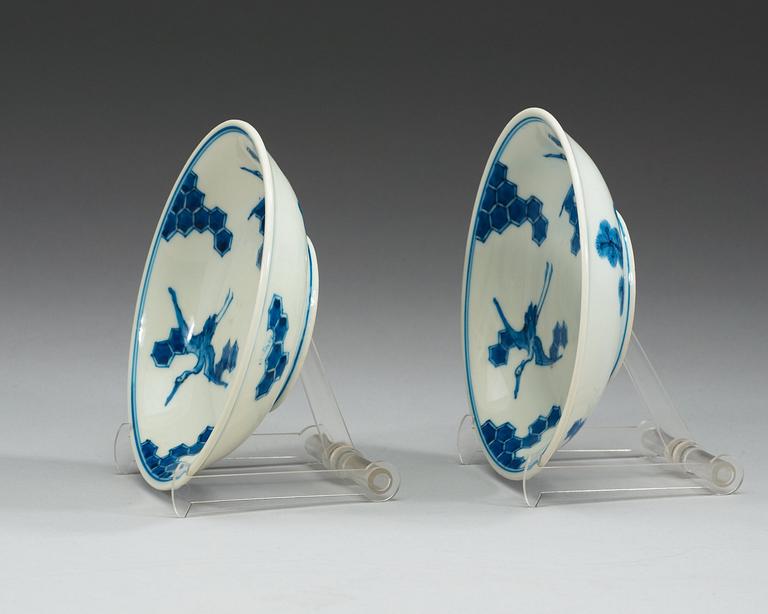 A pair of Japanese blue and white crane dishes, presumably 19th Century.