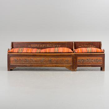 A traditional folk art sofa dated 1852.