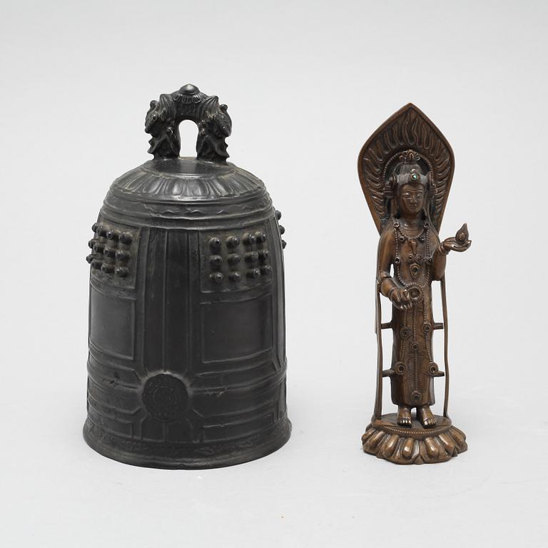 A Chinese temple bell and a figure of a deity, 20th Century.