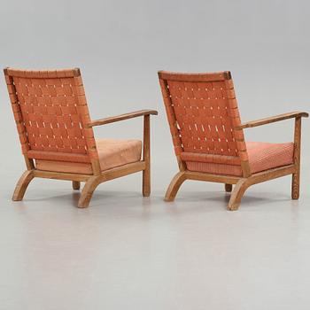 Axel Einar Hjorth, a pair of pine easy chairs, probably model 'Väddö' by Nordiska Kompaniet, Sweden 1930's.