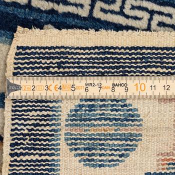 A pair of Baotou rugs, China, c. 120 x 64 cm.