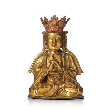 1091. A gilt-bronze figure of Vairochana, Ming dynasty (1638-1644).