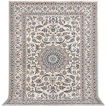 A carpet, Nain, part silk, 9 laa, c. 345 x 246 cm.
