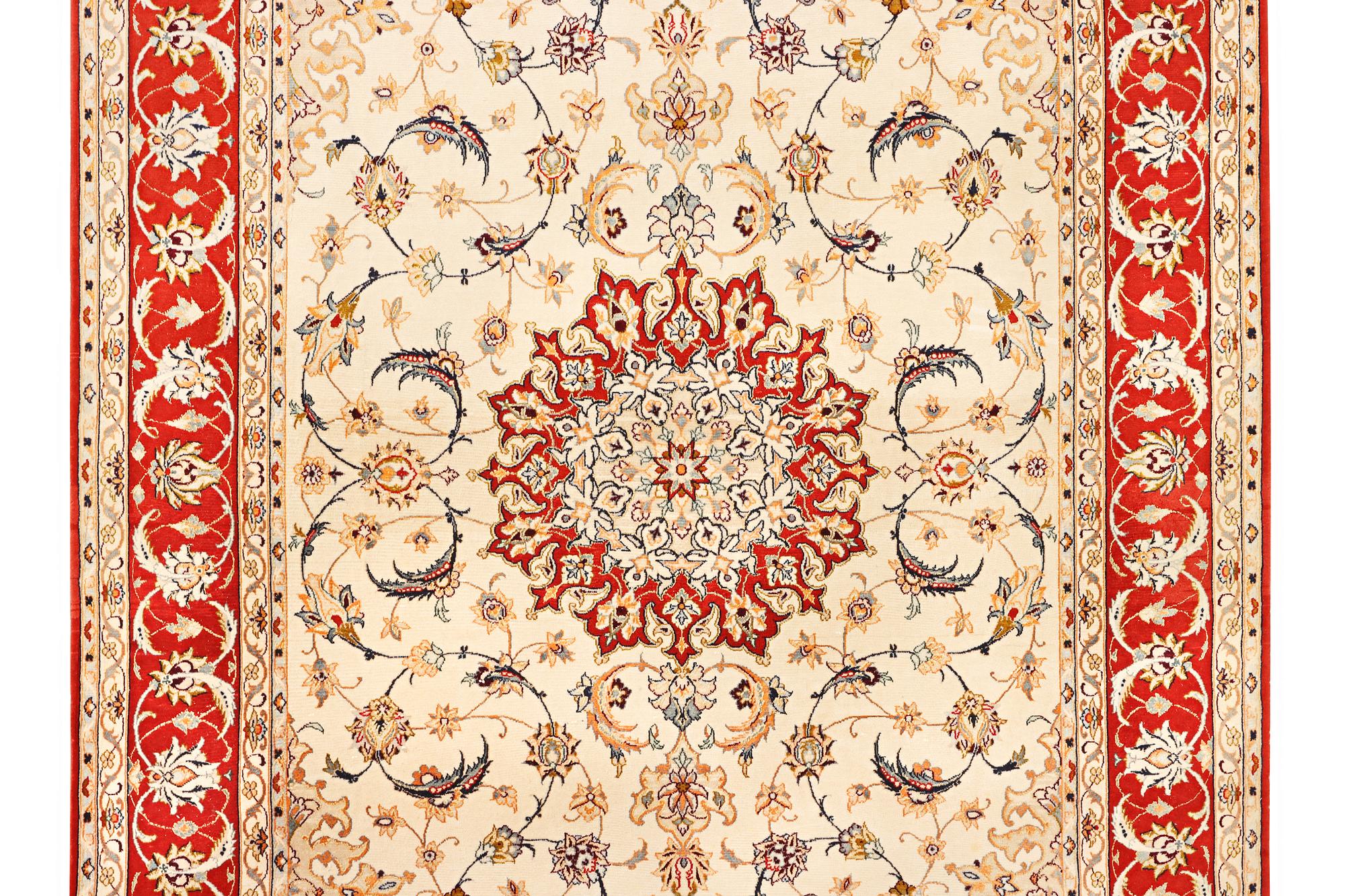 A semi-antique part silk Isfahan rug, a. 238 x 156 cm.