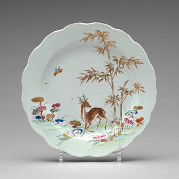 783. A set of eleven famille rose plates, Qing dynasty, Qianlong (1736-95).