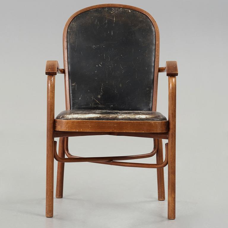 Sigurd Lewerentz, a stained beech and black leather armchair, Gemla, Sweden circa 1932.