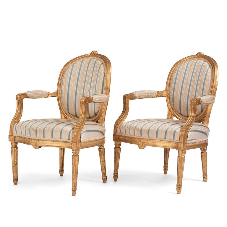 A pair of Gustavian giltwood open armchairs, late 18th century.