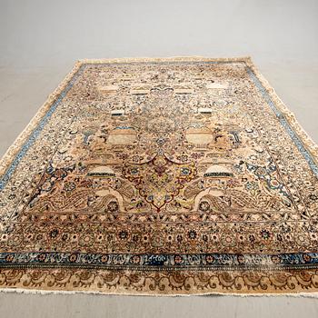 An antique Tabriz carpet, North West Persia, signed Akhondzadeh, c. 394 x 295 cm.