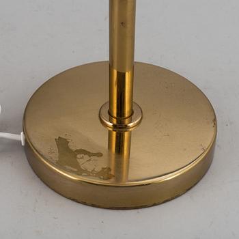 A decond half of the 20th Century brass and glass table light from Bergboms.