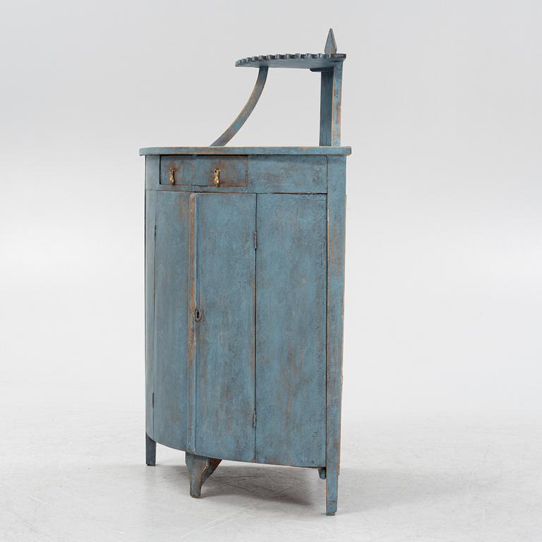 A painted corner cabinet, late 19th century.