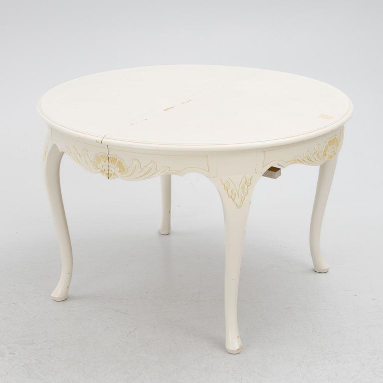 A Rococo style dining table with eight chairs, second half of the 20th century.