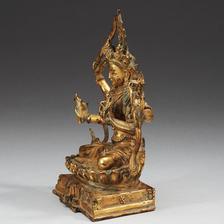 A Tibetan gilt bronze figure of a seated Bodhisattva, Qing dynasty, 18/19th Century.