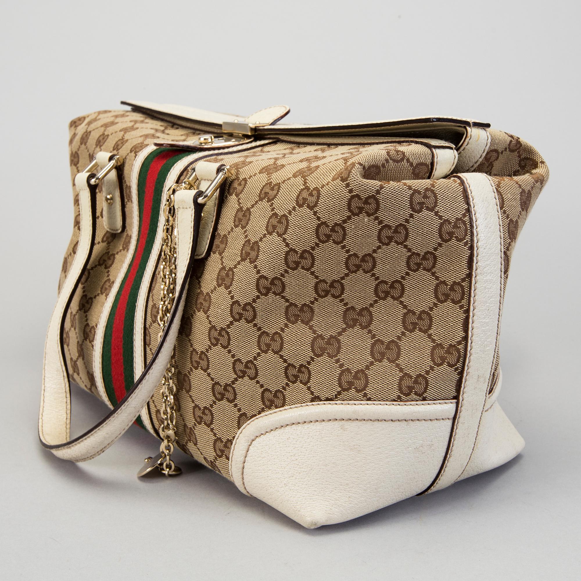 A Gucci canvas and leather hand bag.