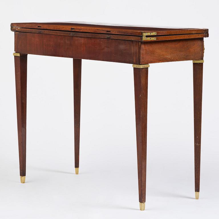 A Gustavian 'concertina action' mahogany games table by Georg Haupt (master in Stockholm 1770-84).