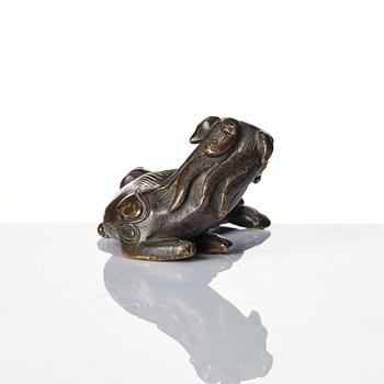A group of four bronze figures, Ming dynasty and older.