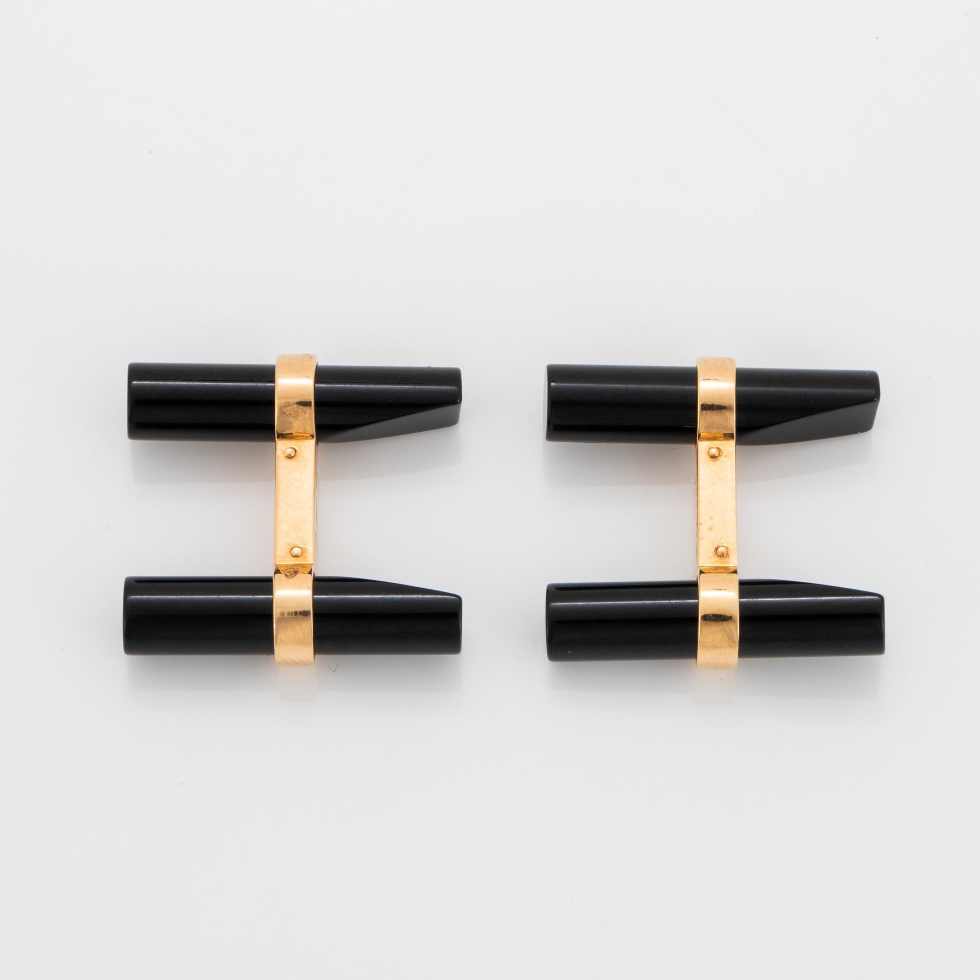 Cartier ett par manschettknappar 18K guld och onyx.